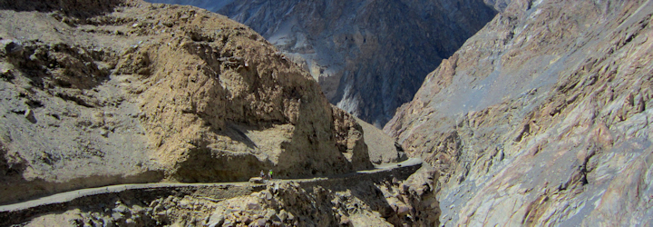 Cycling through high altitude mountain passes on our Kyrgyzstan Karakoram Highway Cycling Tour