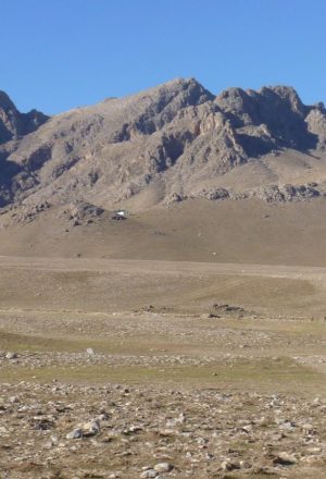 cycling along the plain amongst the mountain regions in Uzbekistan