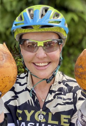 Happy Cyclist with coconuts on our Classic Sri Lanka Cycling holiday
