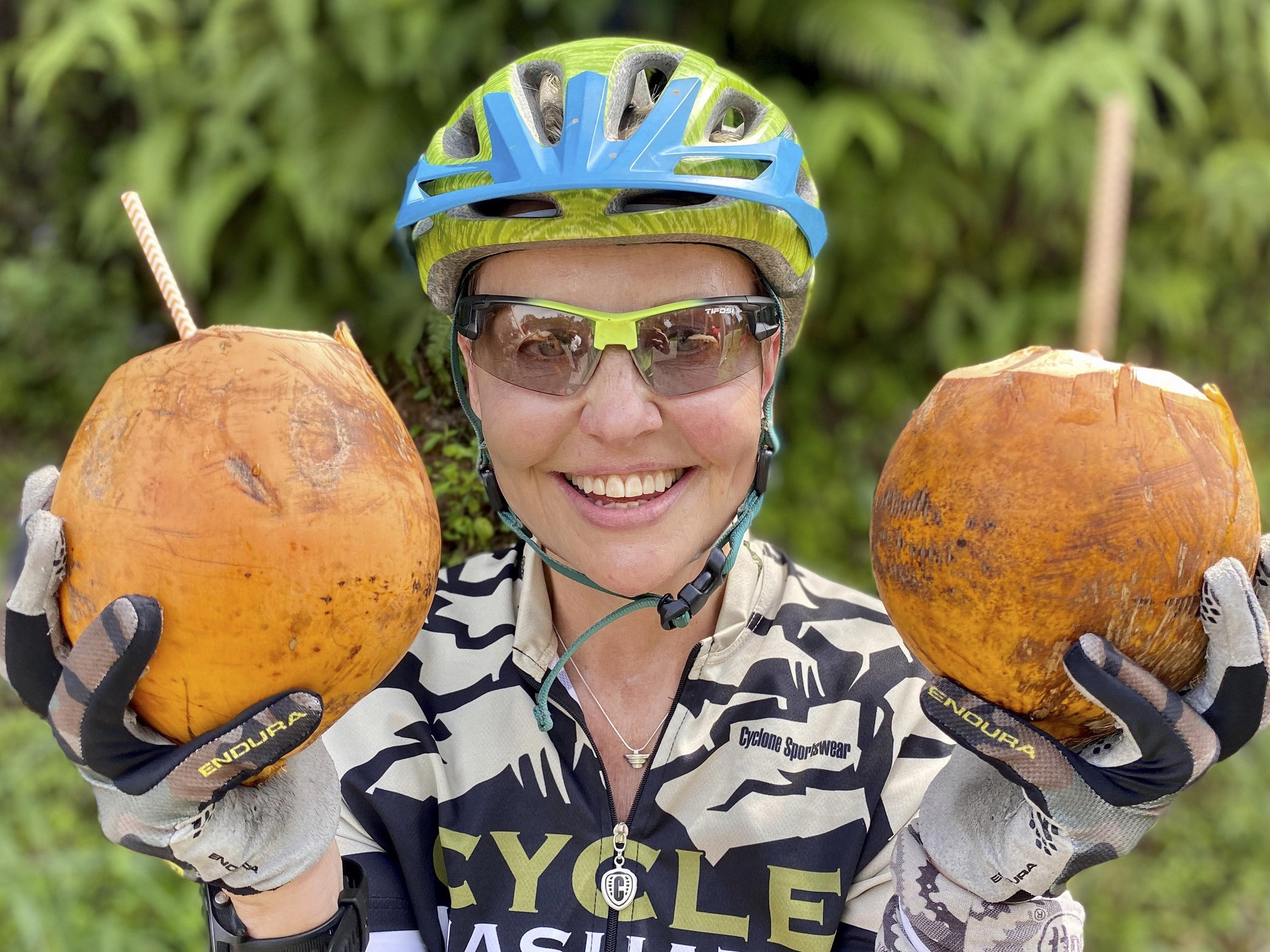 Happy Cyclist with coconuts on our Classic Sri Lanka Cycling holiday